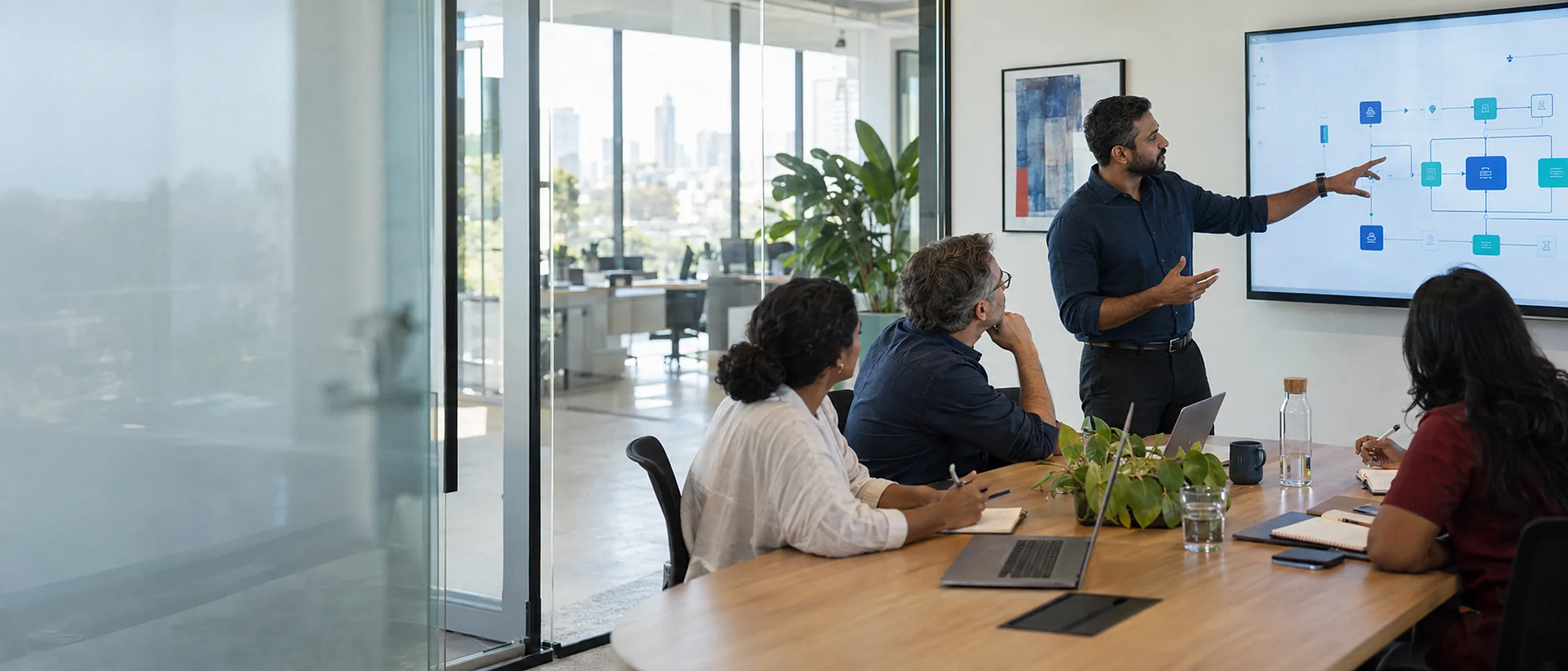 A software architect presenting a system architecture diagram to a client's leadership team in a glass meeting room